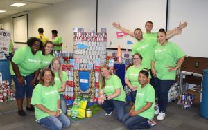 Winning CANstruction team CanUDigIt with their canned good castle