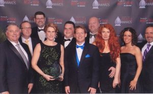 NextGear Capital employees pose with their recently won Mira Award