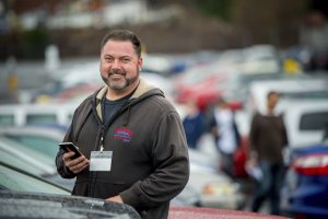 Dealer standing in his lot