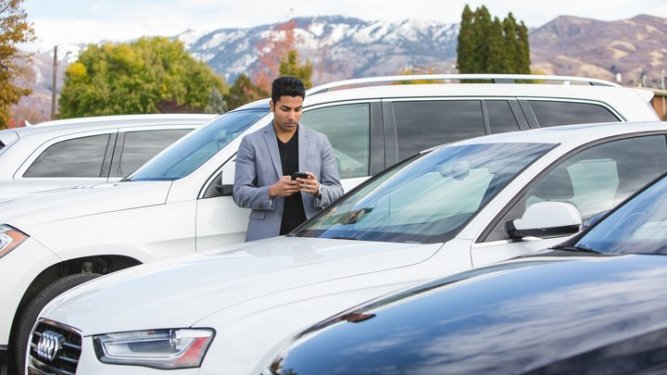 Dealer looking at his inventory
