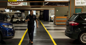 Dealer walking through an empty auction